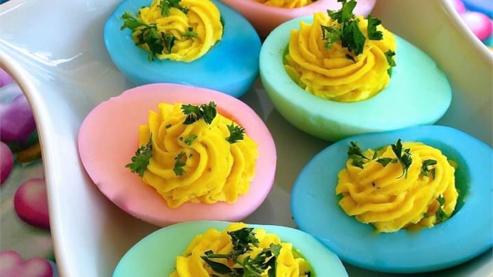 deviled eggs with the whites dyed with Easter colors